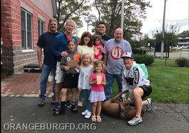 Pictured is Danielle’s family w/Commissioner Joe Sassano, Assistant Fire Chief Ken Gordon and Association Vice President JP Yore
